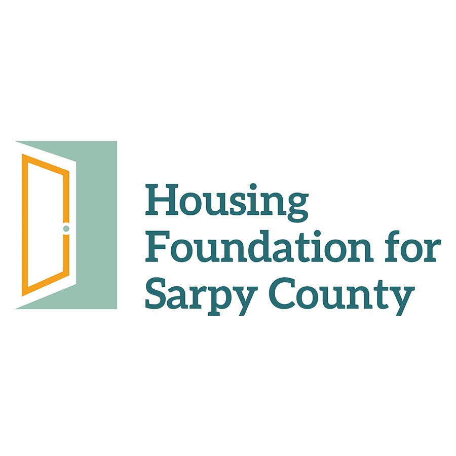 Beardmore Subaru representatives present giant check to Housing Foundation Executive Director.
