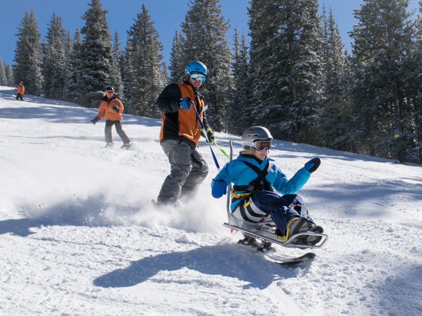 ASPNM athlete Cassidy takes to the slopes of Ski Santa Fe in a bi-ski with instructor Jason Cline. Cassidy has skied with ASPNM for over 20 years. Impact